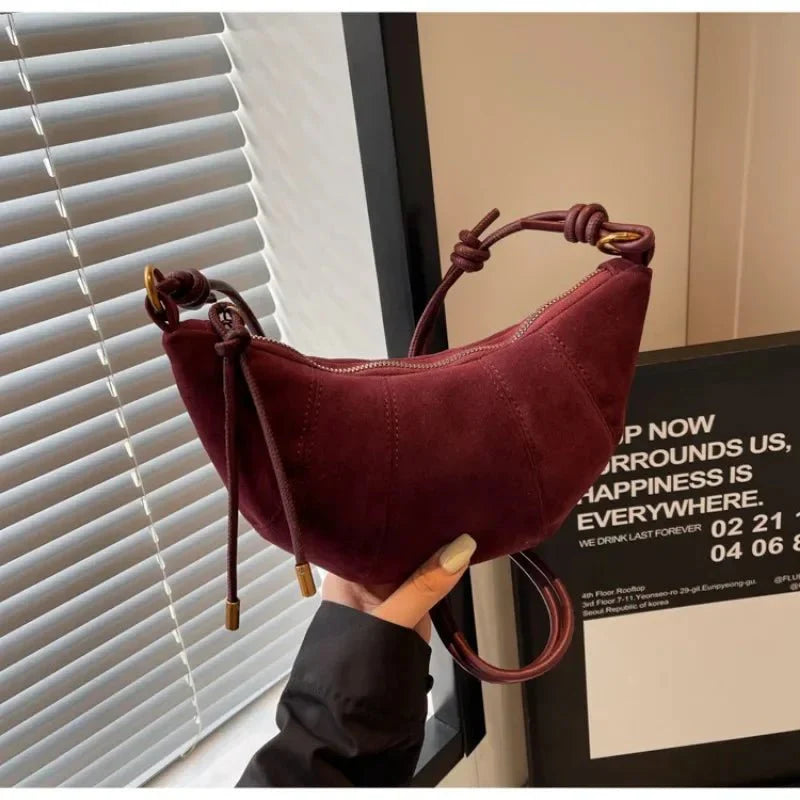 Suede crescent crossbody bag