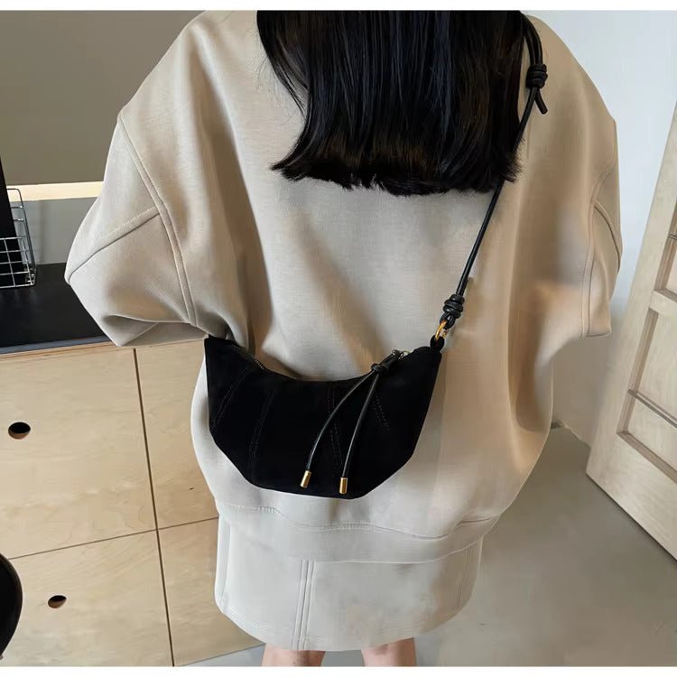 Suede crescent crossbody bag