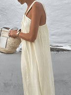 Elegant Cream Halter Dress with Long Flowing Skirt