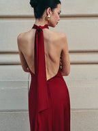 Elegant Halter Dress with Flowing Satin and Open Back