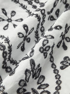 V-Neck Dress with Embroidery and Belt Detail