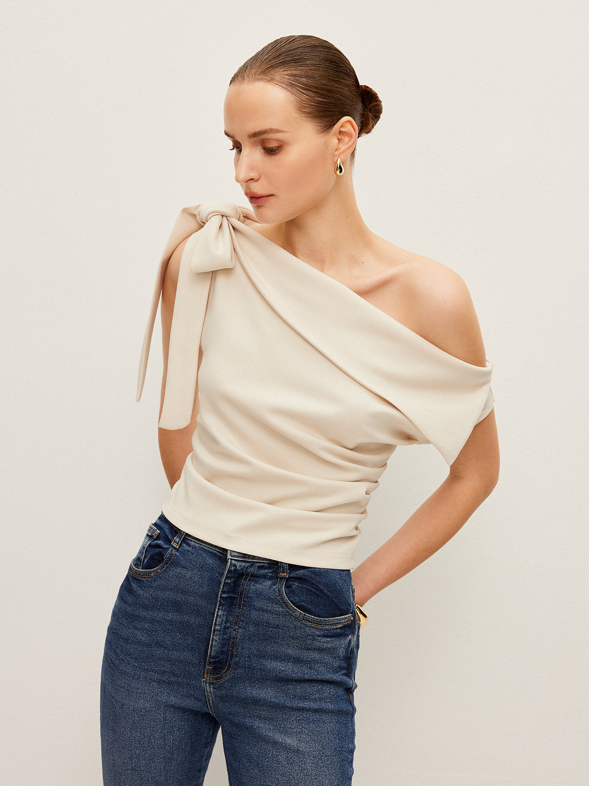 One-Shoulder Blouse Featuring Elegant Bow Detail